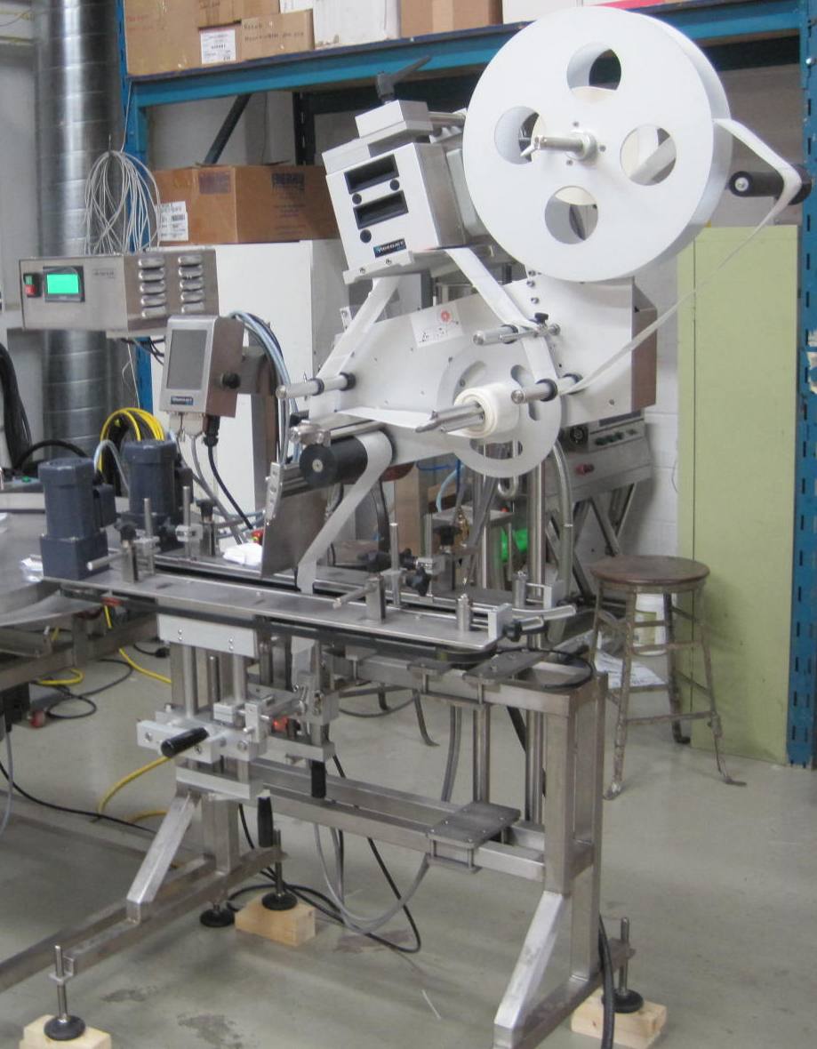 LM-CS150 Clamshell Labeler - Speedway Packaging Machinery